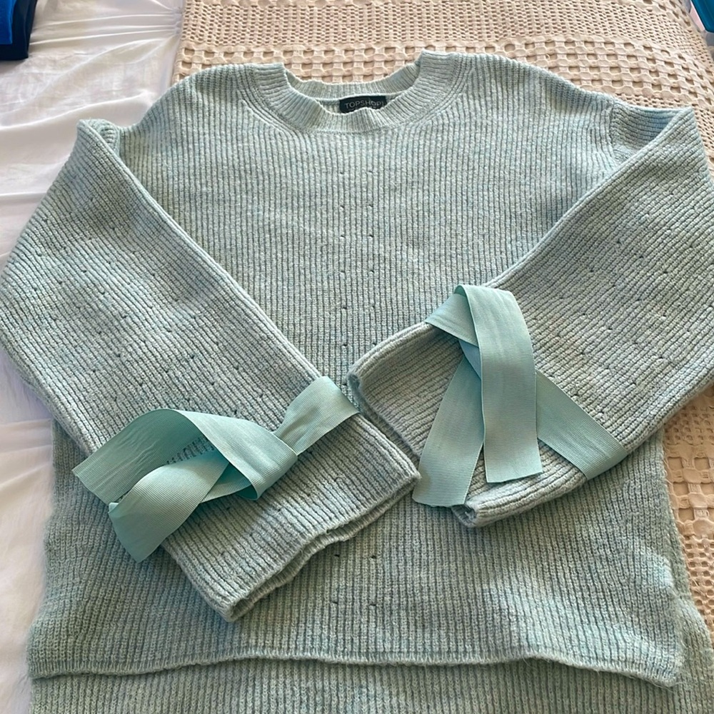 Top shop tie cuff sweater. Light blue color size 6.
